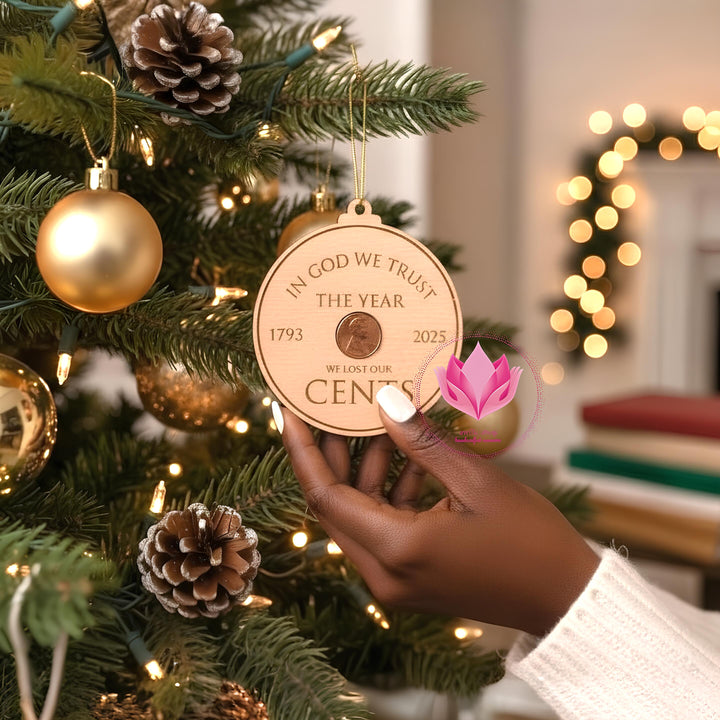 Handcrafted commemorative ornament featuring a real U.S. penny engraved with historic dates honoring the end of the American penny.