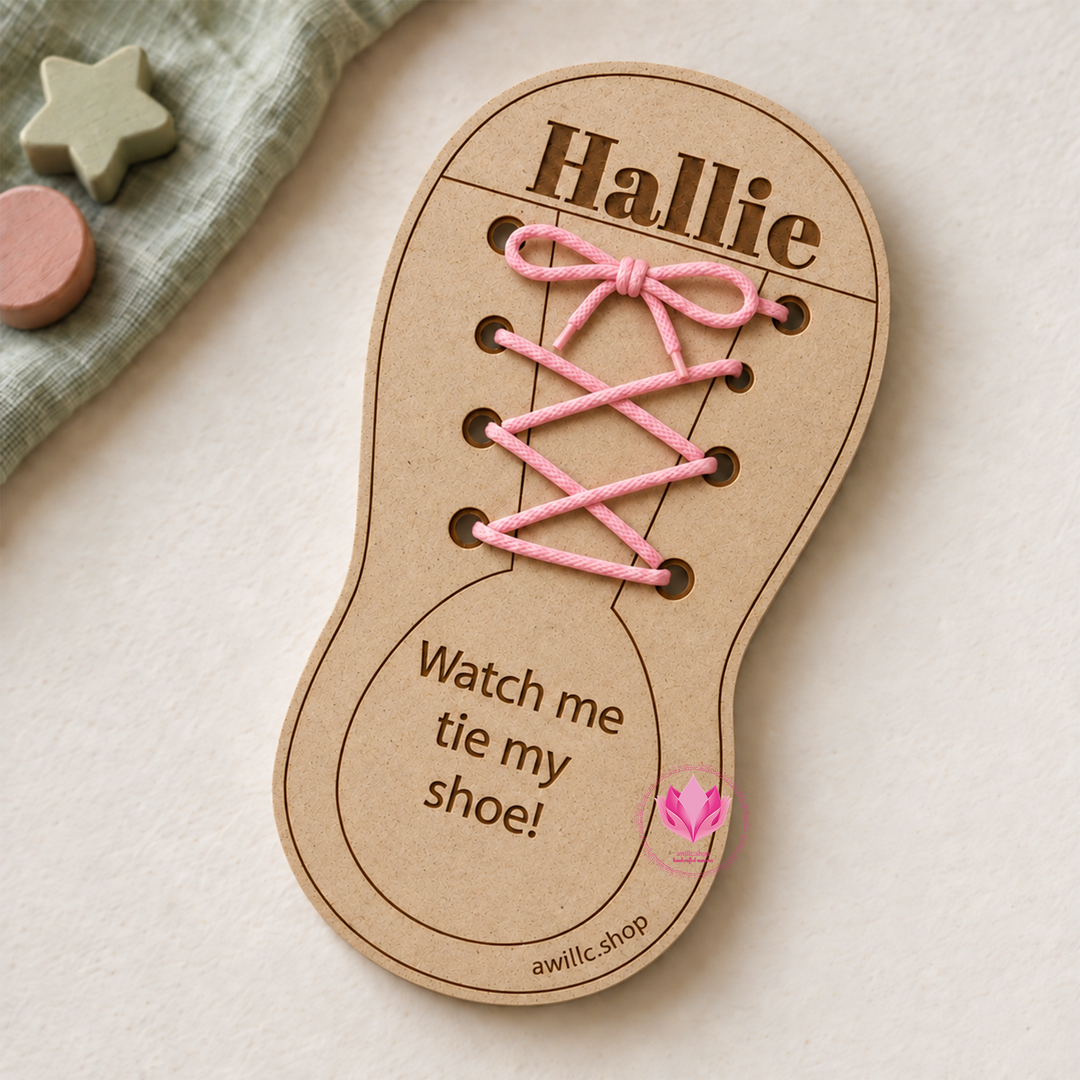 Personalized wooden shoe tying practice board engraved with Hallie, pink laces and the message Watch me tie my shoe.