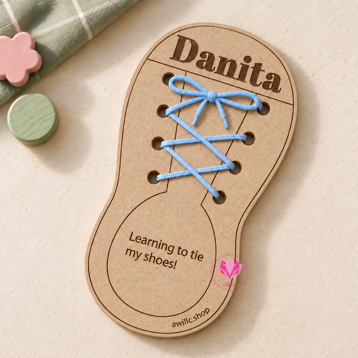 Personalized wooden shoe tying practice board engraved with Danita, blue laces and the message Learning to tie my shoes.